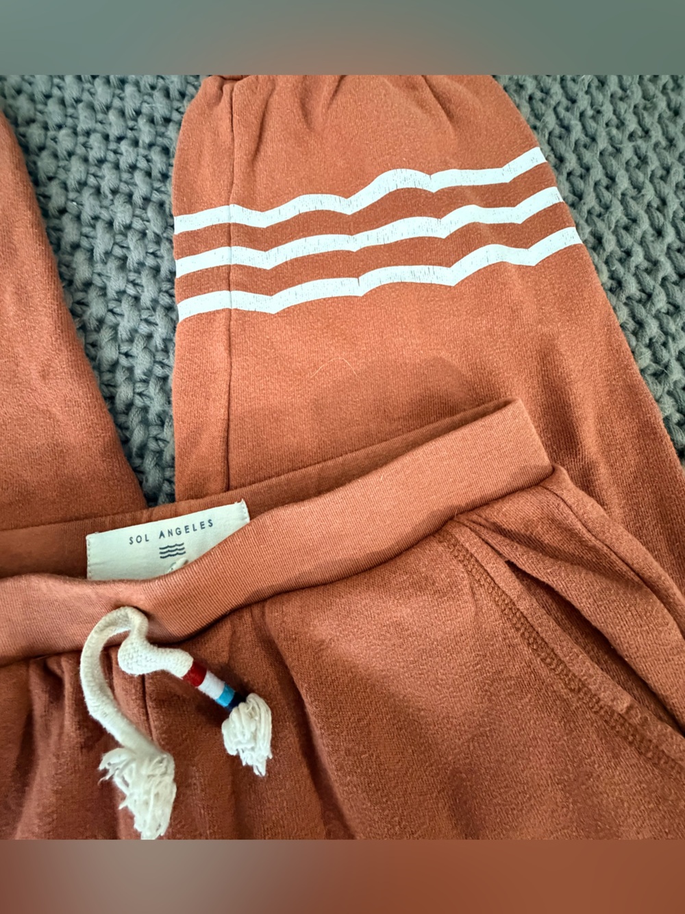 Sol Angeles Rust Orange Kids Sweatpants with White Stripe Detail